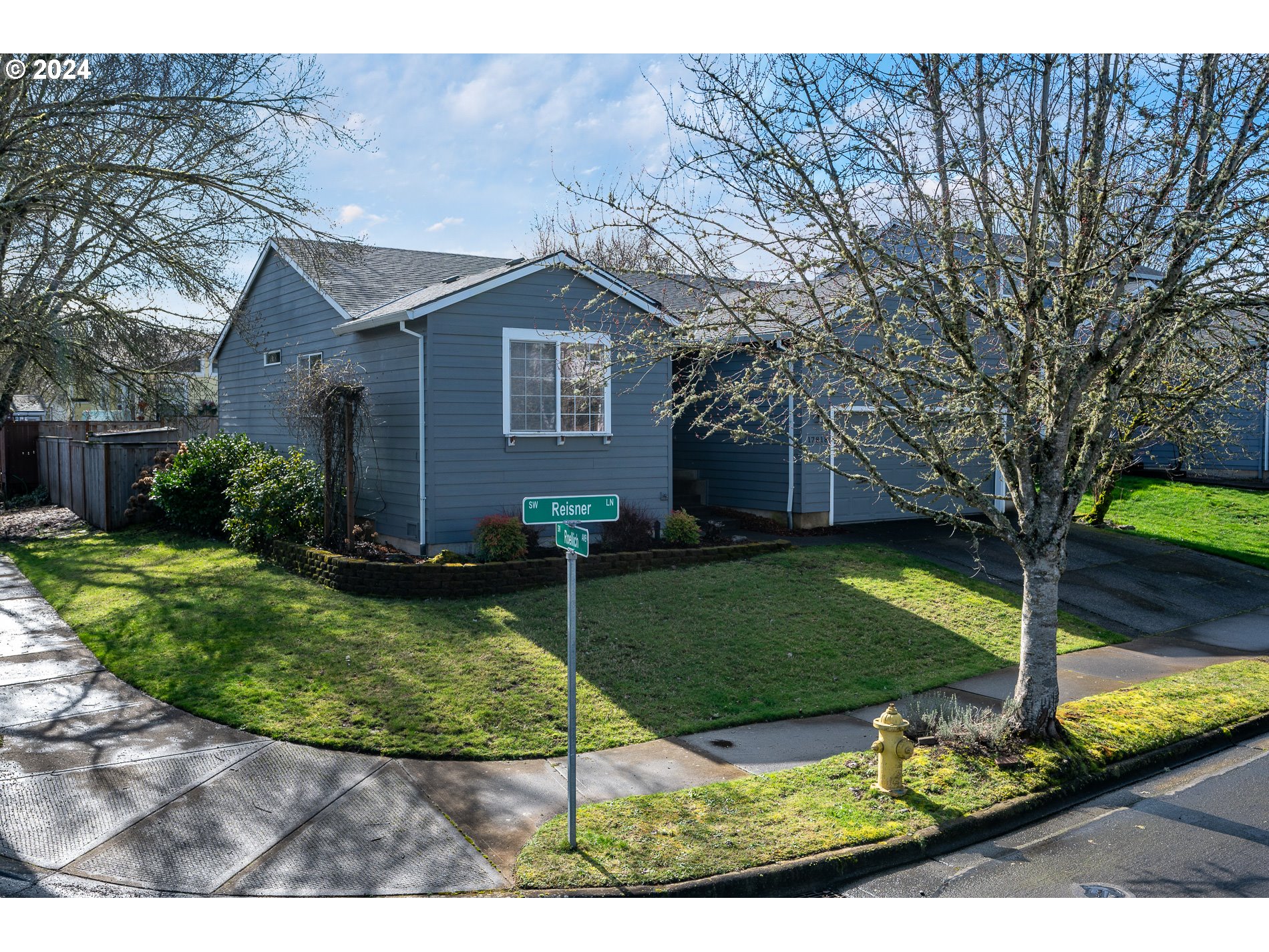 17818 Southwest Reisner Lane Sherwood, OR 97140 - Photo 2 of 20 a front view of a house with garden