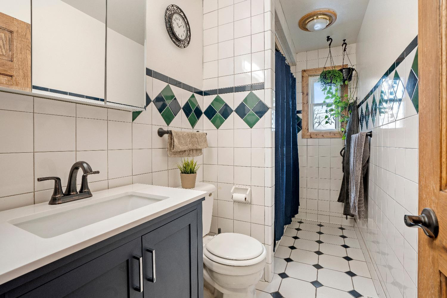 1412 North Elmer Street Griffith, IN 46319 - Photo 12 of 23 a bathroom with a sink a toilet and shower