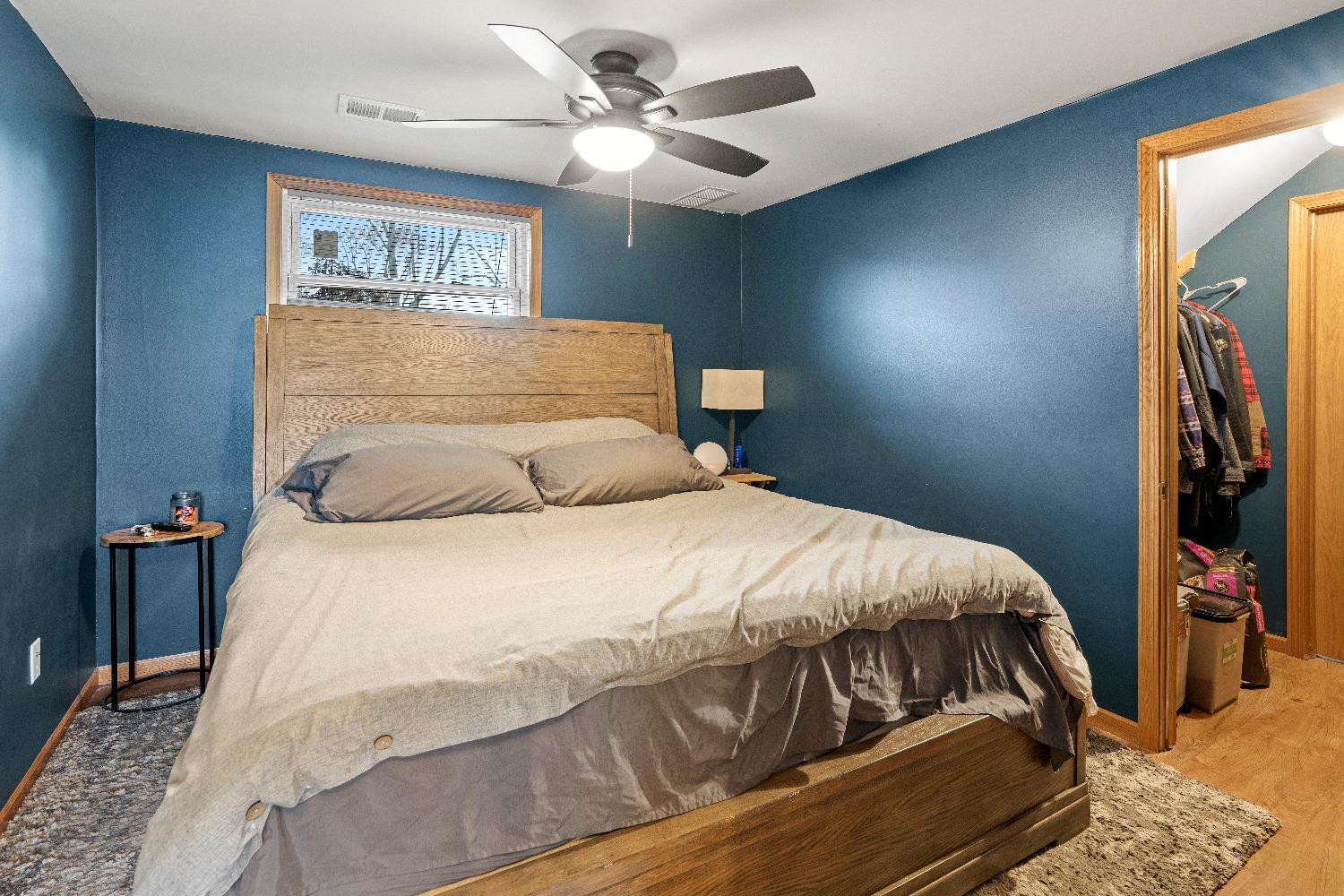 1412 North Elmer Street Griffith, IN 46319 - Photo 15 of 23 a bedroom with a bed and a chandelier