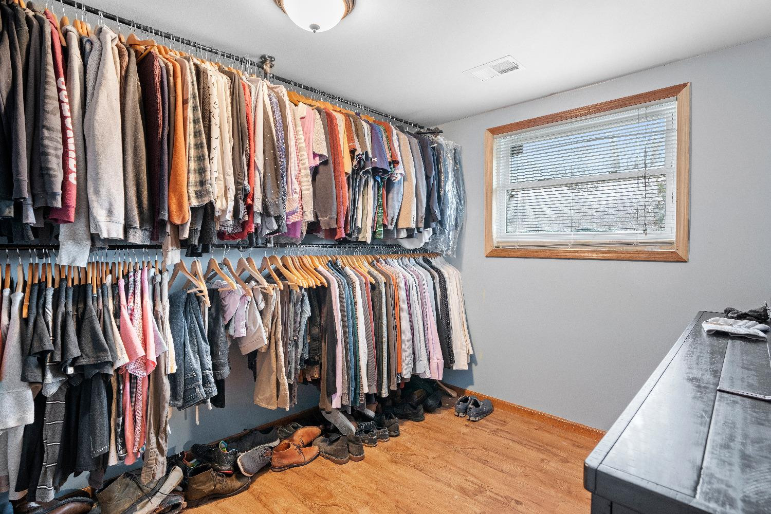 1412 North Elmer Street Griffith, IN 46319 - Photo 16 of 23 a view of walk in closet with clothes and shoes