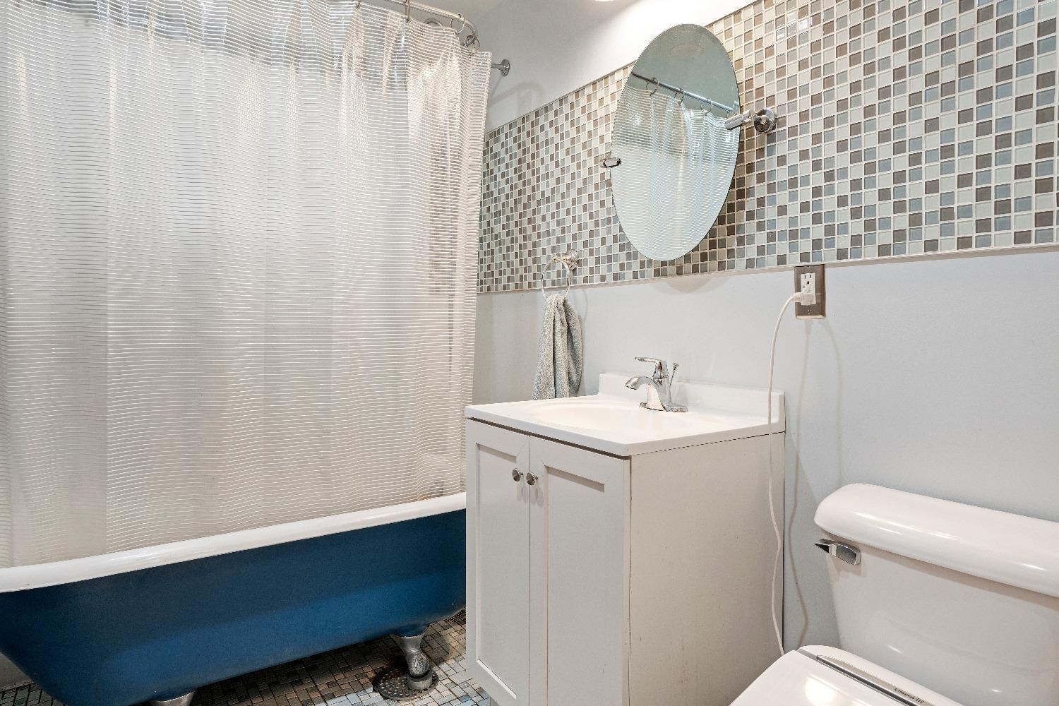 1412 North Elmer Street Griffith, IN 46319 - Photo 17 of 23 a bathroom with a sink toilet and a mirror