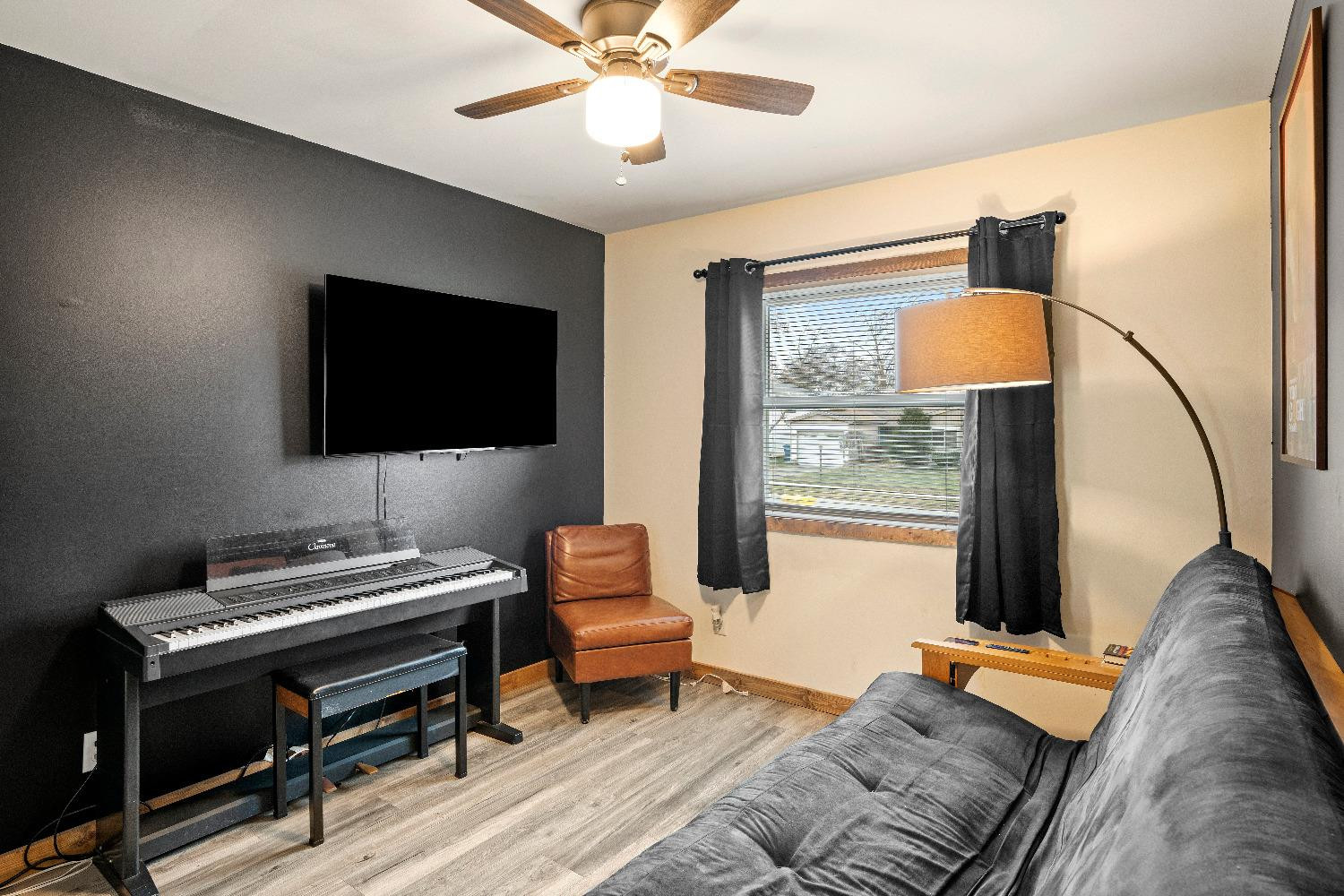 1412 North Elmer Street Griffith, IN 46319 - Photo 9 of 23 a bedroom with furniture and a flat screen tv