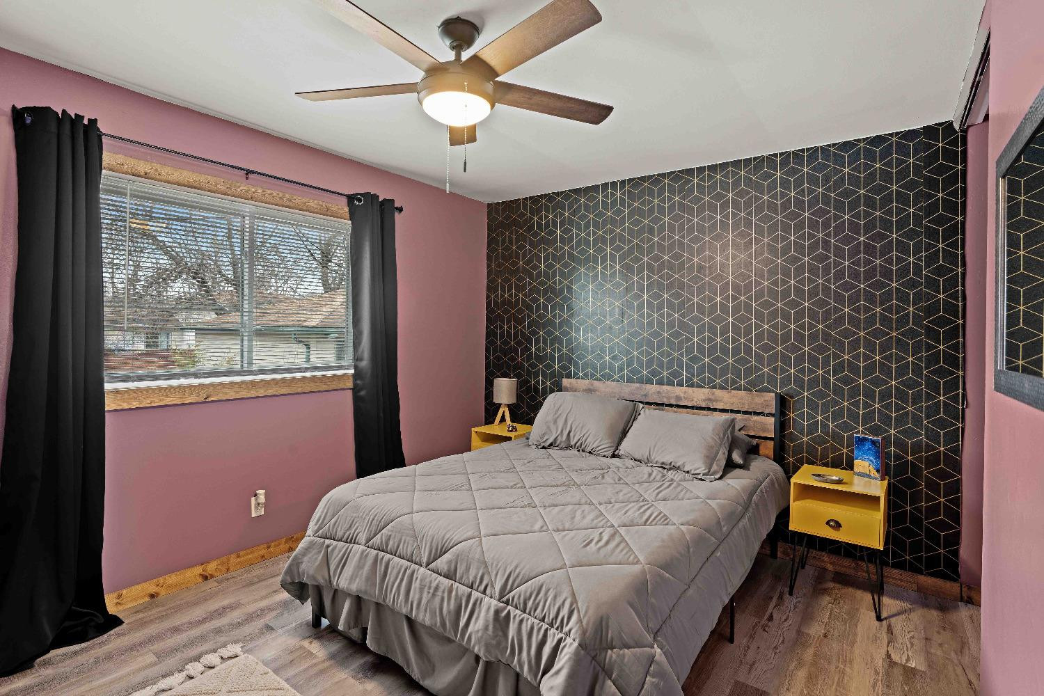 1412 North Elmer Street Griffith, IN 46319 - Photo 10 of 23 a bedroom with a bed and wooden floor