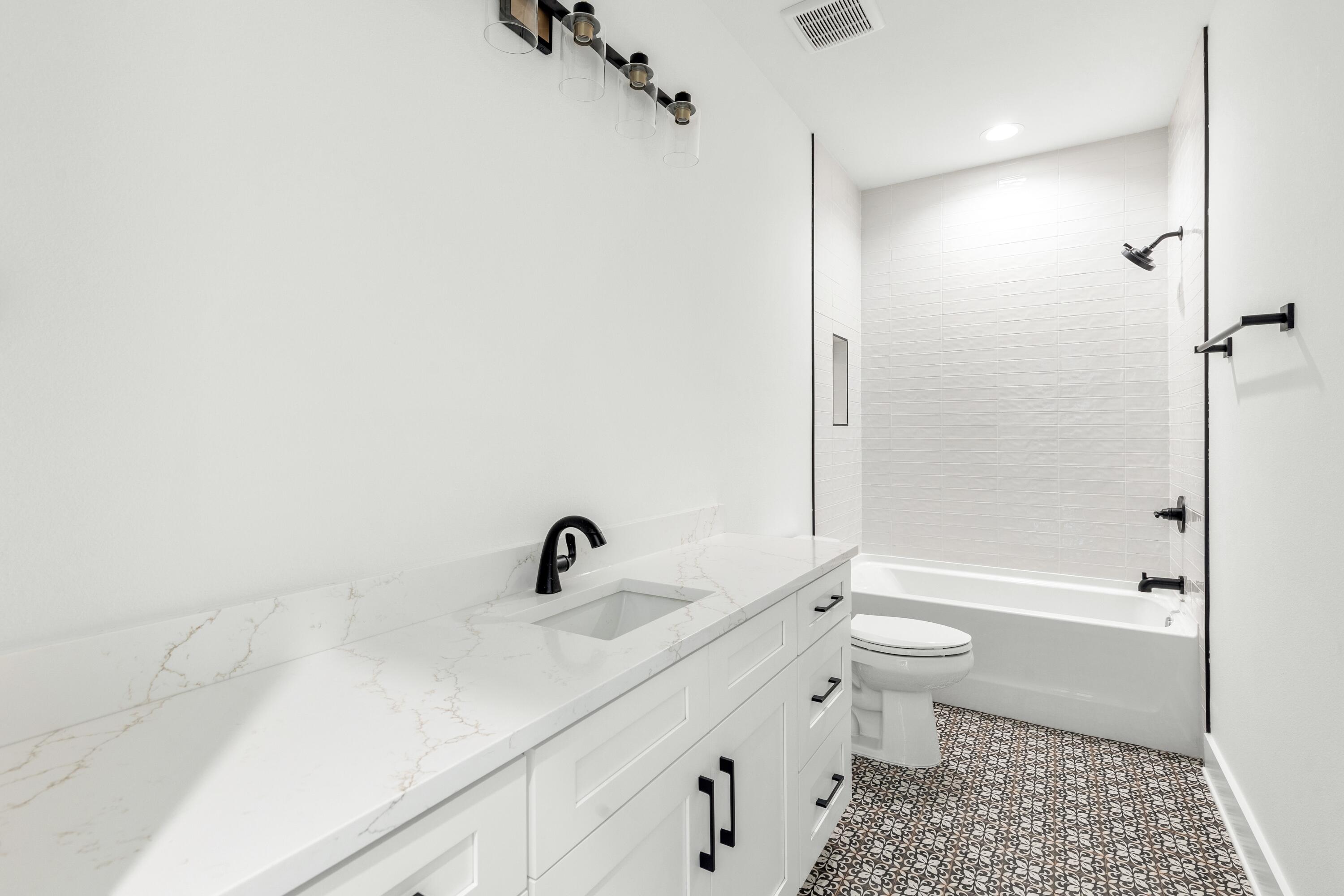 80 Clarke Hl Road Freeport, FL 32439 - Photo 13 of 33 a bathroom with a sink a toilet and shower