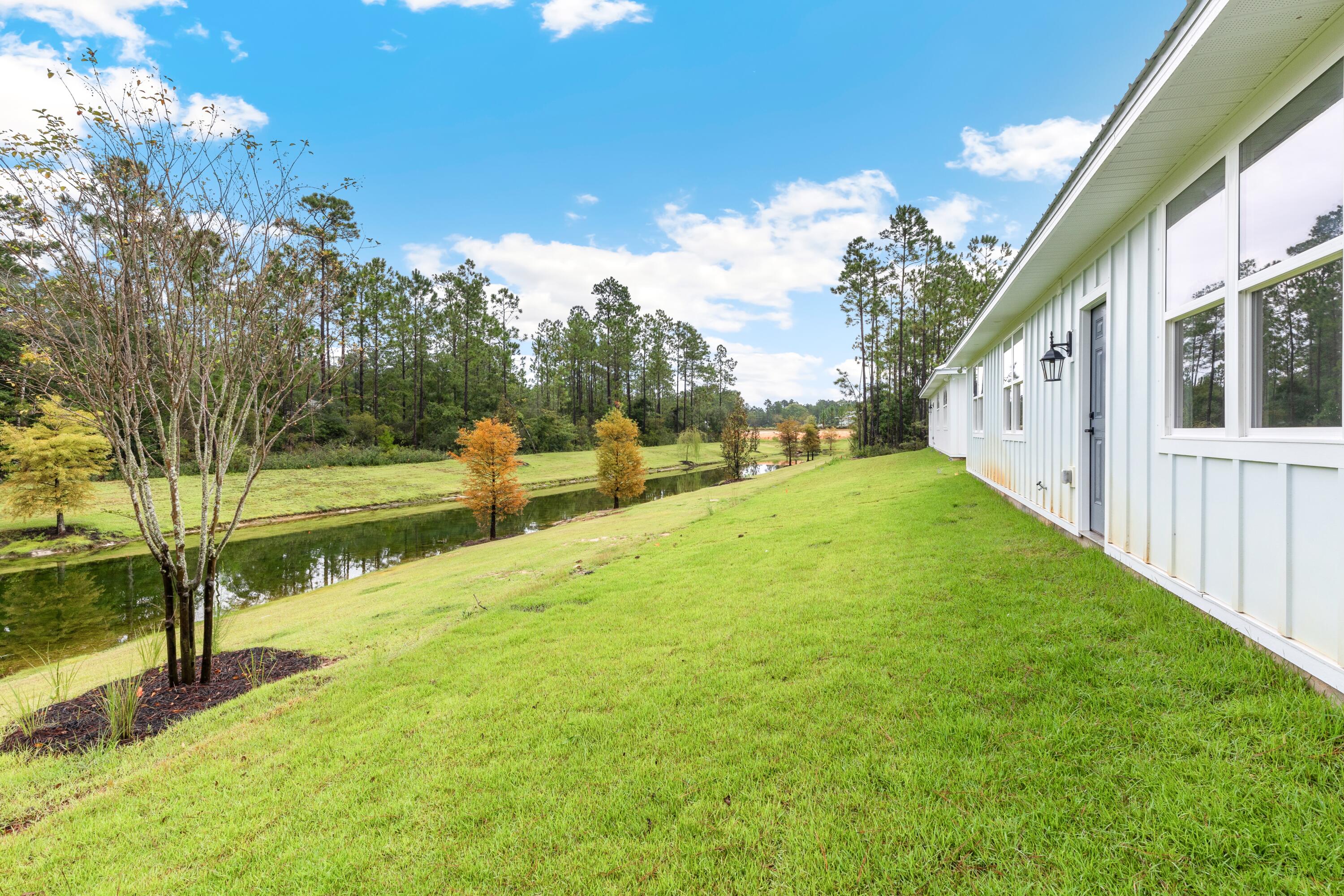 80 Clarke Hl Road Freeport, FL 32439 - Photo 20 of 33 a view of a house with a yard