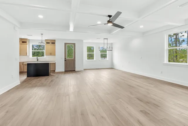 a view of livingroom with hardwood floor and a ceiling fan