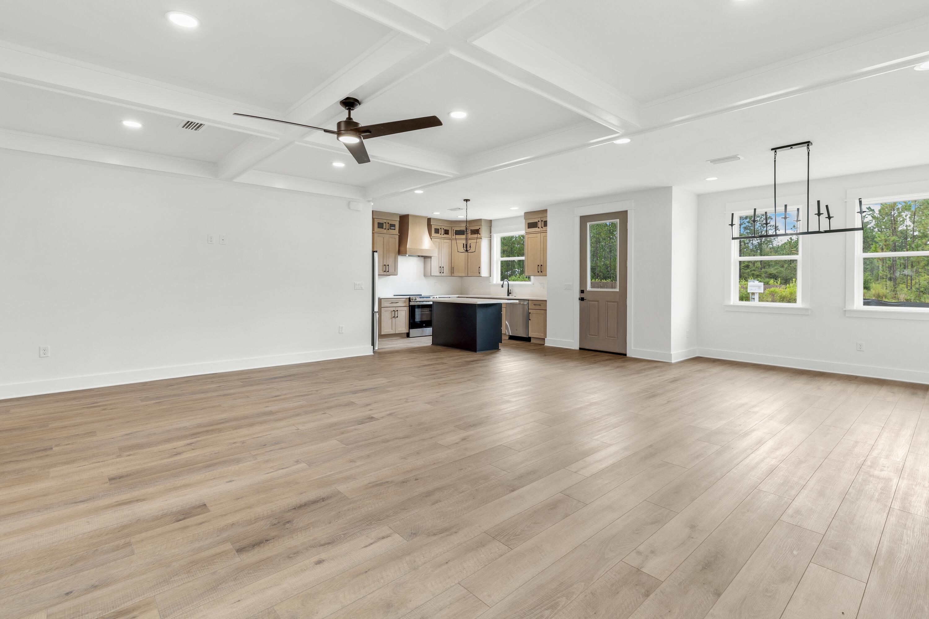 80 Clarke Hl Road Freeport, FL 32439 - Photo 5 of 33 an empty room with wooden floor and windows