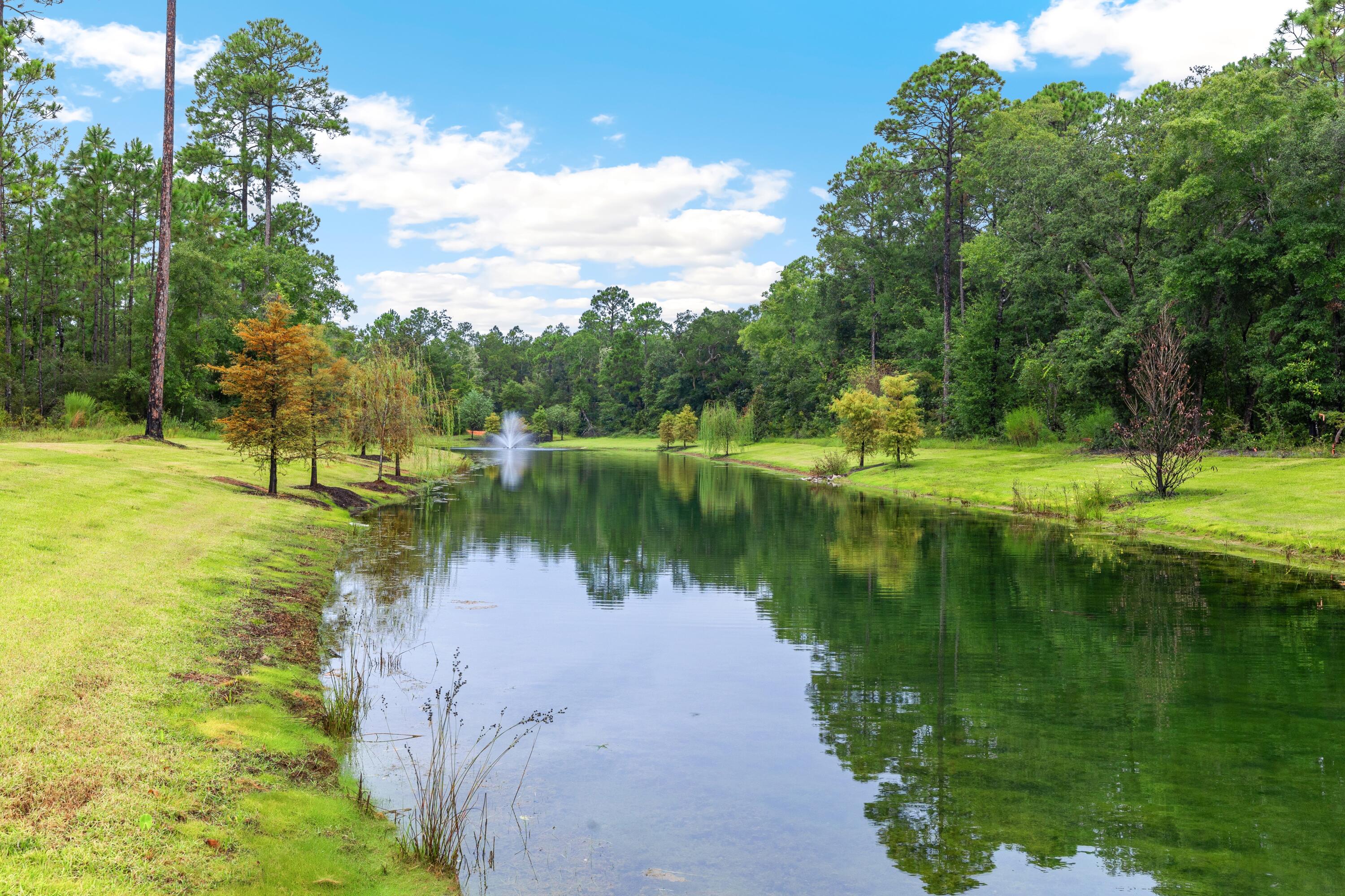 80 Clarke Hl Road Freeport, FL 32439 - Photo 7 of 33 a view of a lake with a yard and large trees