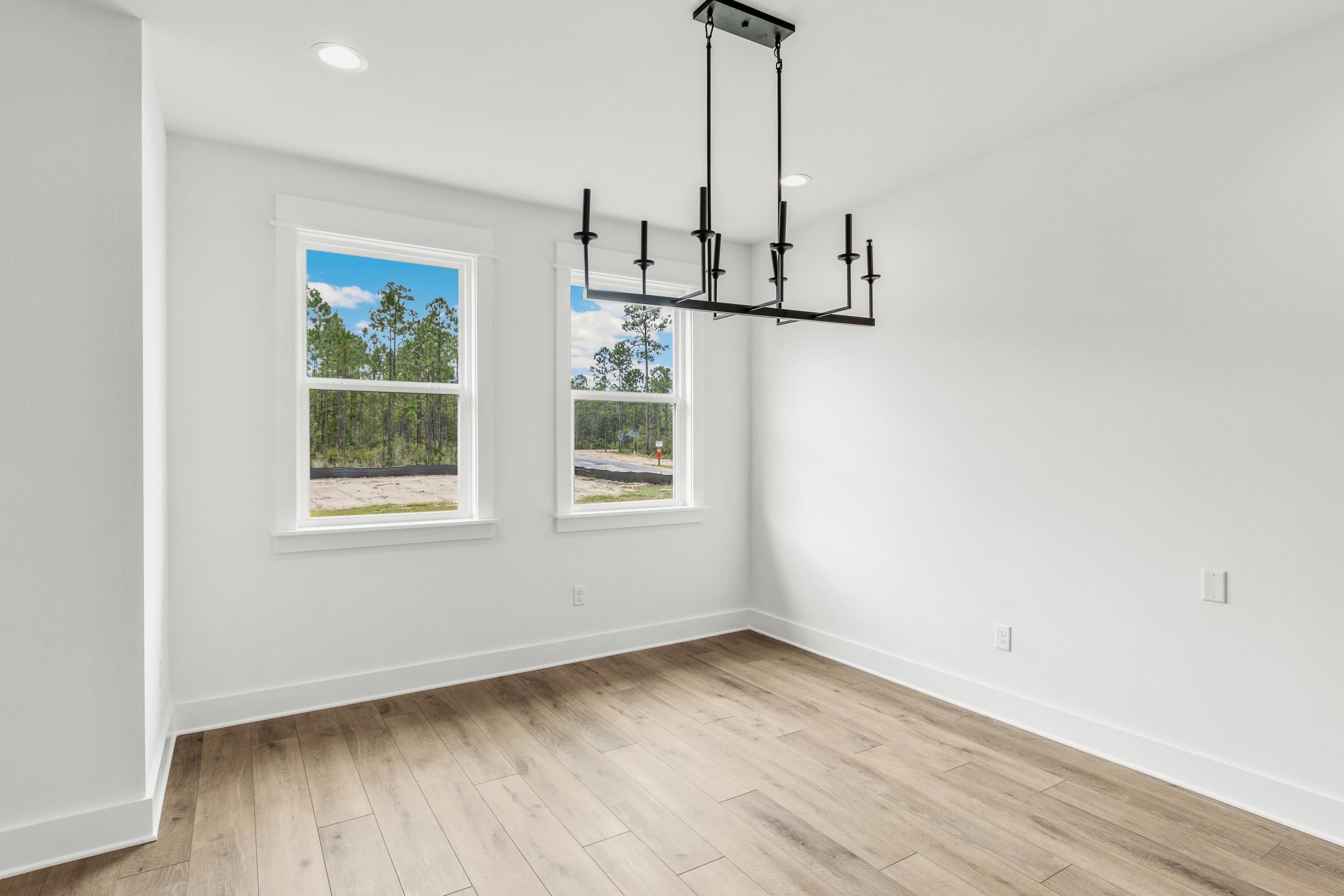 80 Clarke Hl Road Freeport, FL 32439 - Photo 10 of 33 a view of empty room with wooden floor and window