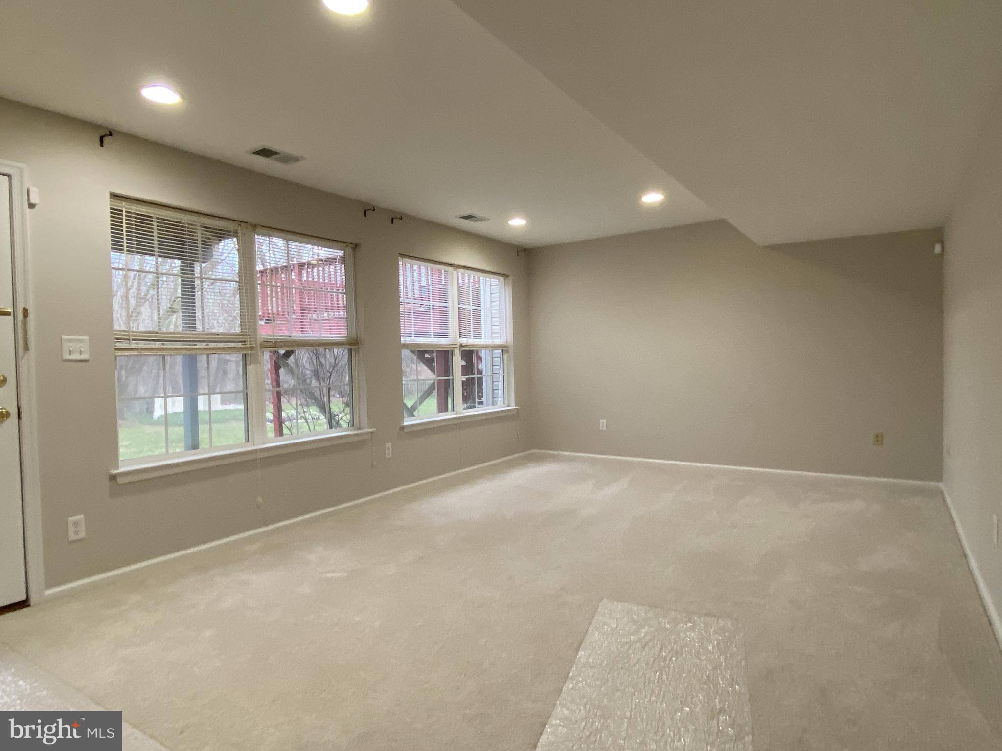 5 Sycamore Lane Bear, DE 19701 - Photo 30 of 38 Lower Level Family Room w/ Carpet & Recessed Light