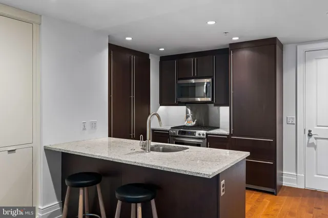 a kitchen with a table and chairs