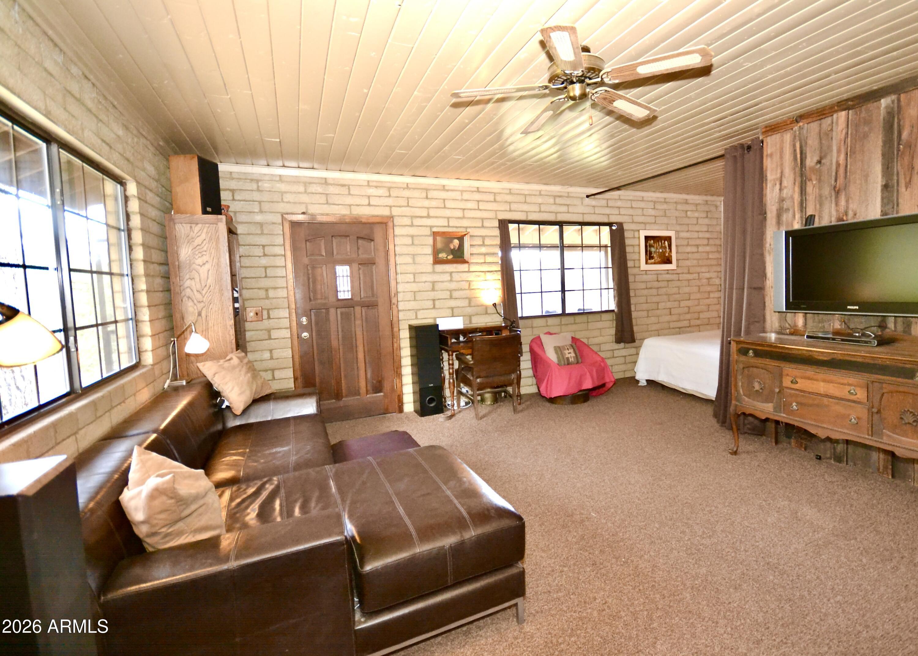 23617 South Demascus Road Crown King, AZ 86343 - Photo 20 of 50 a living room with furniture and a flat screen tv
