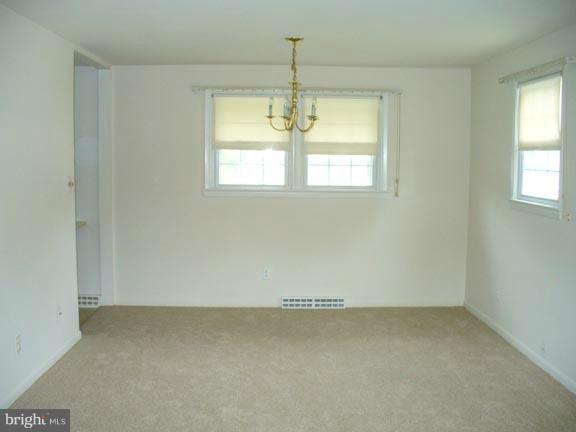 6794 Amherst Road Bryans Road, MD 20616 - Photo 3 of 7 an empty room with a window