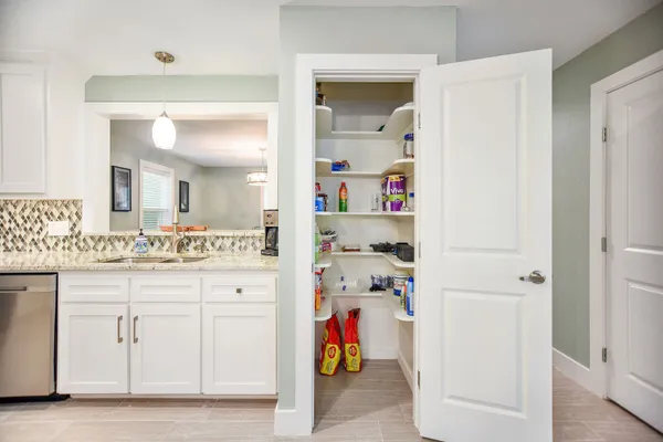 a bathroom with a sink vanity and mirror
