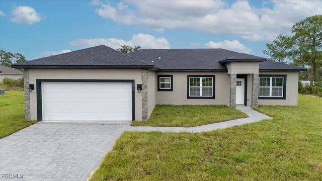 a front view of a house with garage