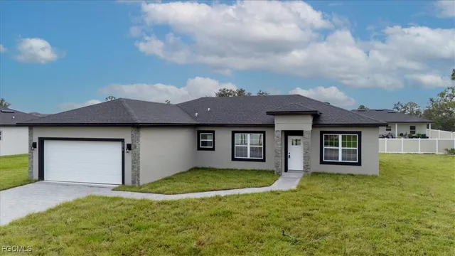 an aerial view of a house with a garden