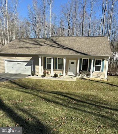 a view of house with back yard
