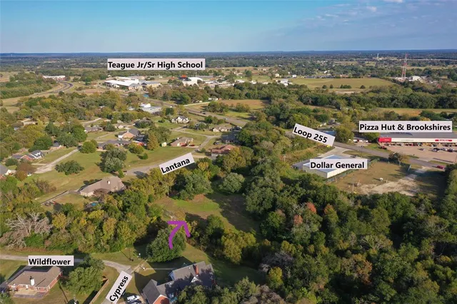 an aerial view of residential building with parking space