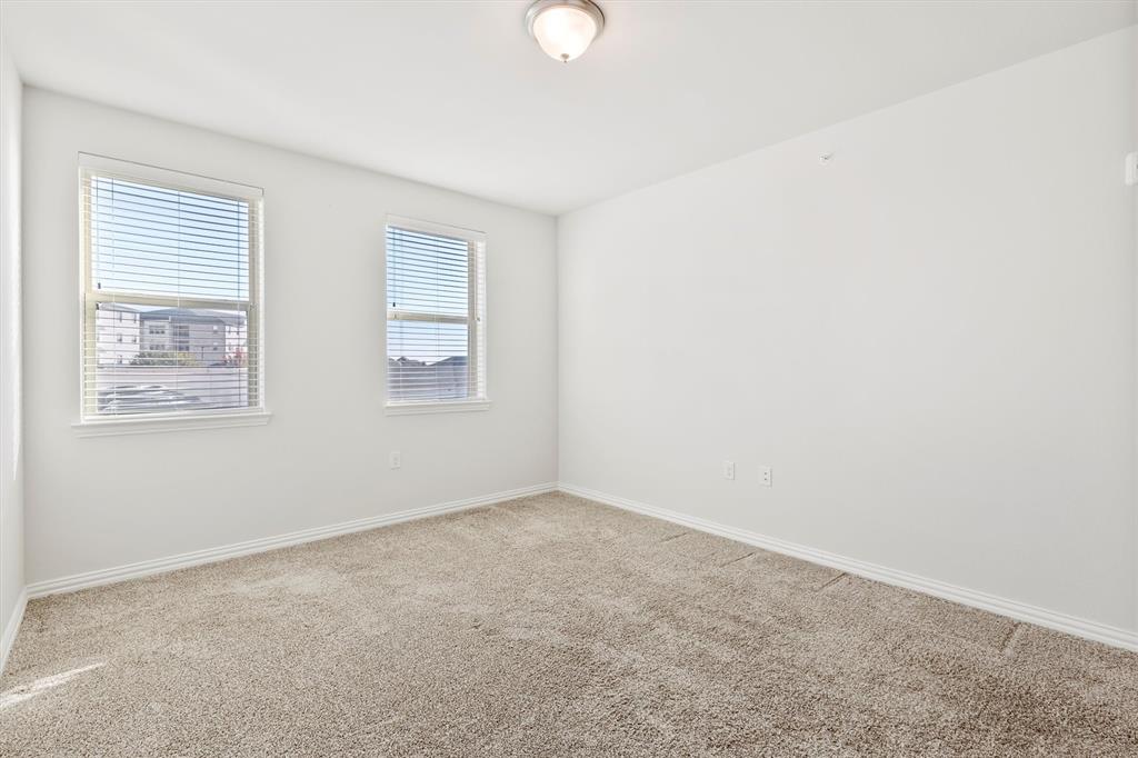 651 Watters Road, Unit 7202 Allen, TX 75013 - Photo 19 of 33 an empty room with windows and closet