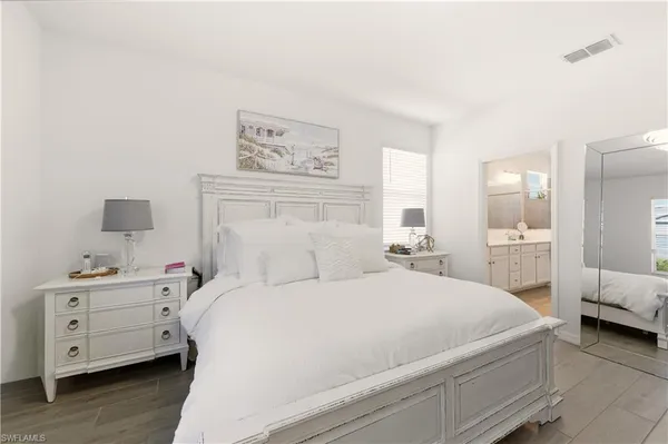 a room with a bed and a view of bedroom