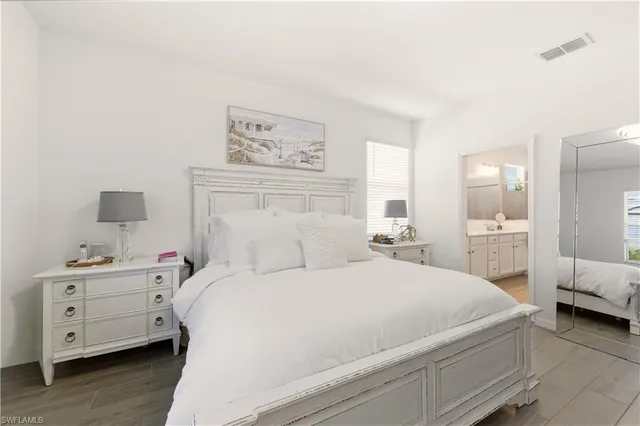 a room with a bed and a view of bedroom