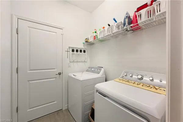 a utility room with dryer and washer
