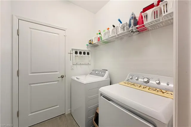 a utility room with dryer and washer
