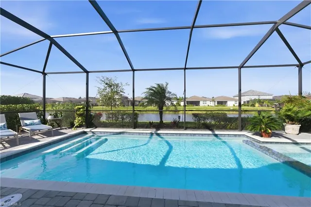 a view of a swimming pool with a patio