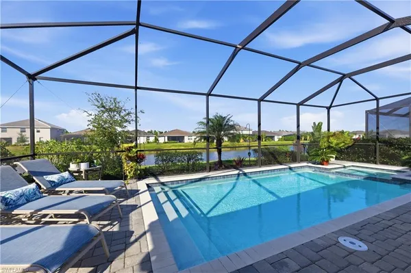 a view of a swimming pool with a patio