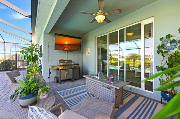 a living room filled with furniture and a potted plant