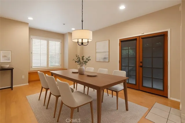 a open kitchen with stainless steel appliances granite countertop a refrigerator and a stove top oven