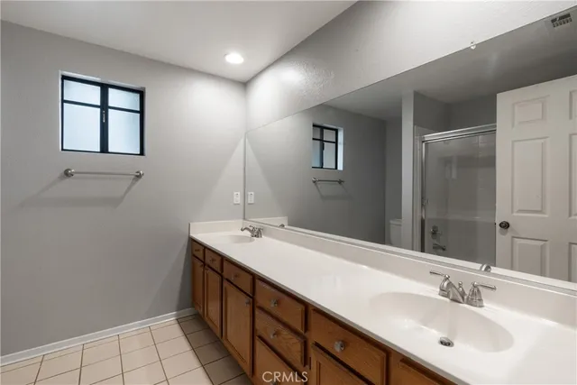 a bathroom with a glass shower door