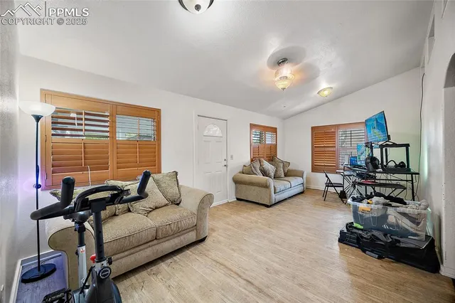 a living room with furniture or couch and a flat screen tv