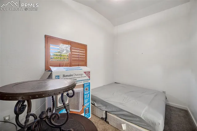 a room with a table and chairs