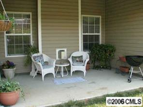 11328 Chapeclane Road Charlotte, NC 28278 - Photo 3 of 5 a view of a patio with table and chairs and potted plants