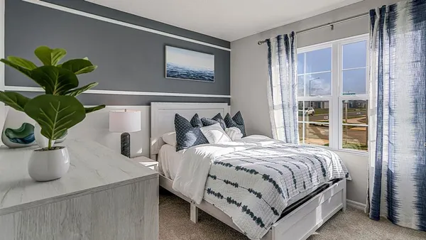 a kitchen with a sink and a potted plant