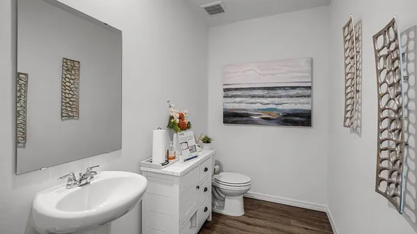 a view of a dining room with furniture and a mirror