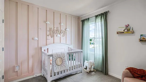 a kitchen with a wooden floor and cabinets