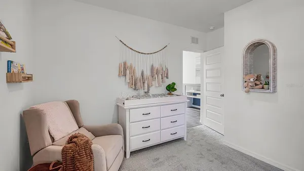 a room that has a bed and a table in it