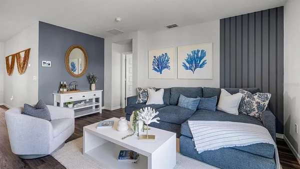 a living room with furniture and a window