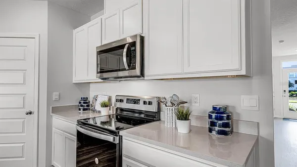 a kitchen with a sink and cabinets