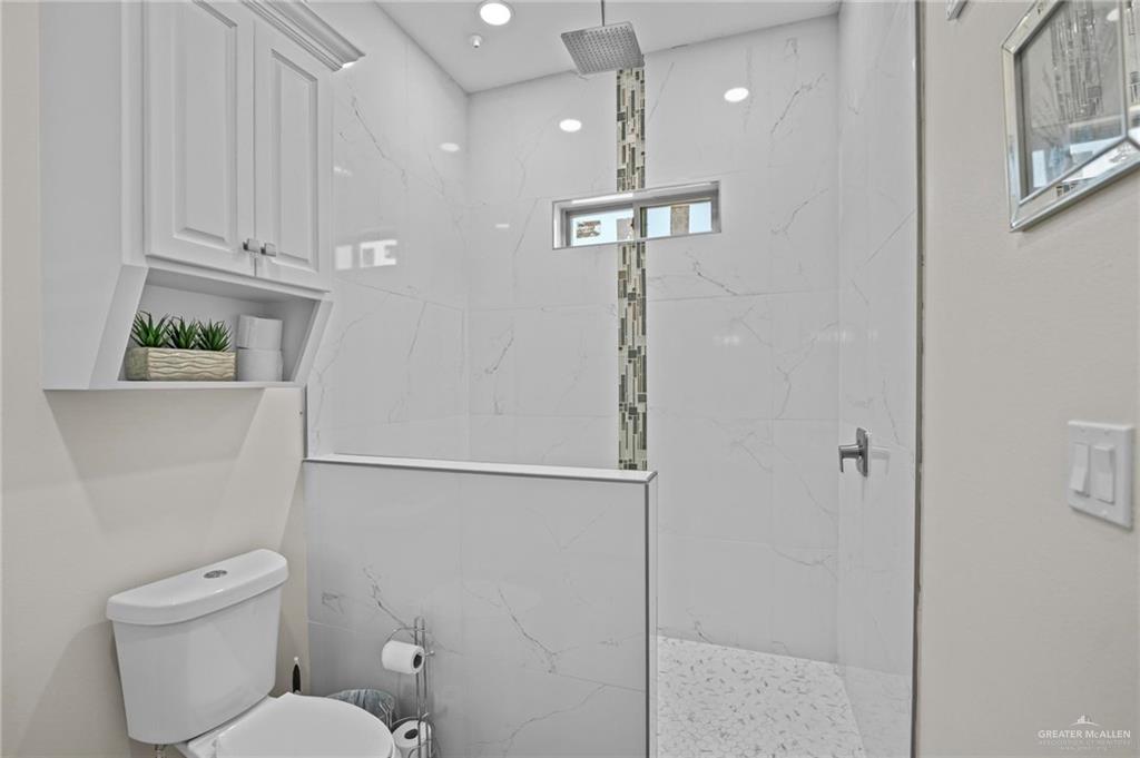 1110 Raptor Street Palmview, TX 78572 - Photo 18 of 31 Bathroom with a marble finish shower and toilet
