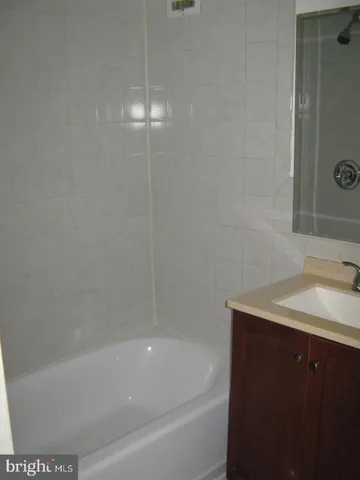 a bathroom with a sink and a bathtub