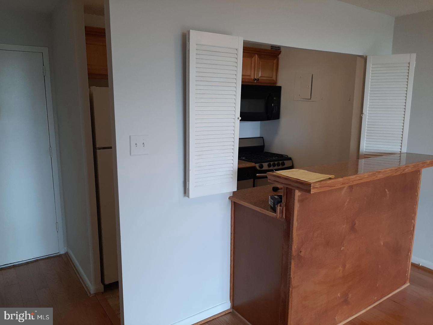 2500 North Van Dorn Street, Unit 419 Alexandria, VA 22302 - Photo 7 of 20 a kitchen with a refrigerator and a stove