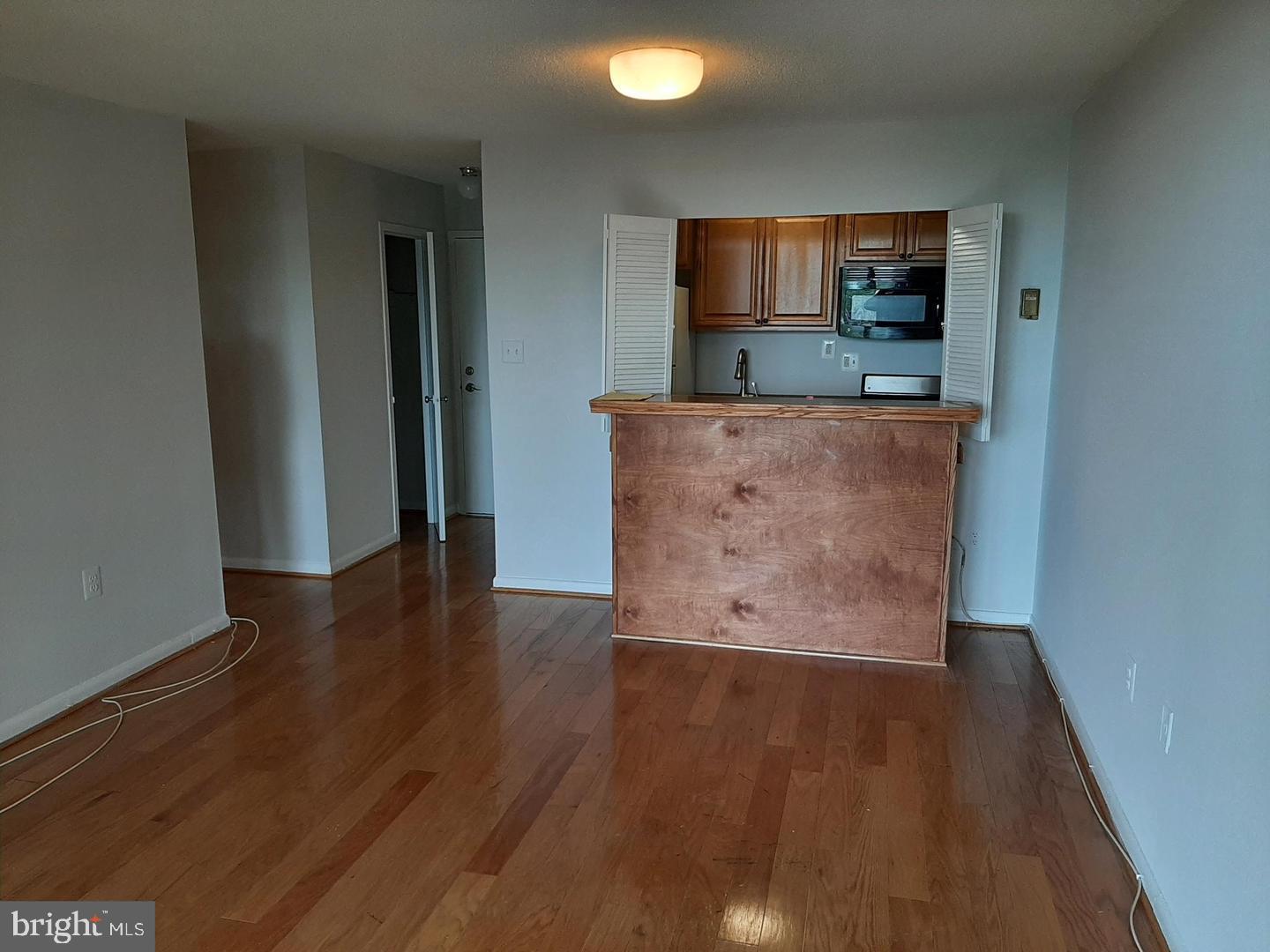 2500 North Van Dorn Street, Unit 419 Alexandria, VA 22302 - Photo 10 of 20 a view of kitchen with microwave and cabinets