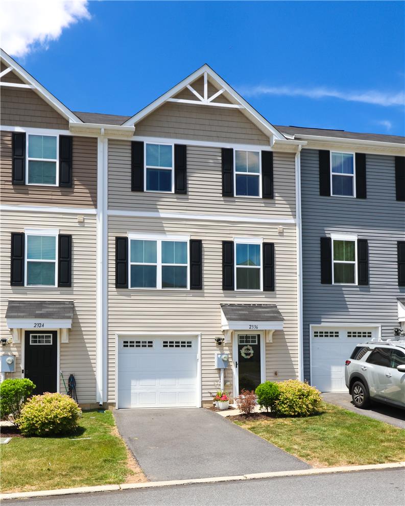 2336 Alex Road Easton, PA 18040 - Photo 29 of 35 A well-maintained facade features vinyl siding and a single-car garage, offering comfortable living.