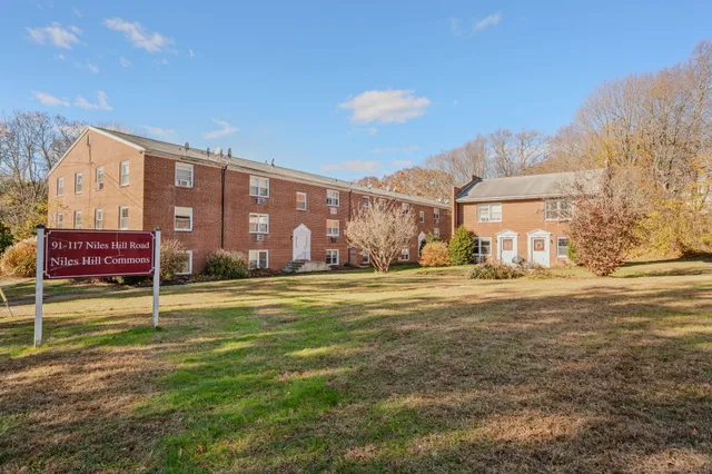 a swimming pool with outdoor seating and yard