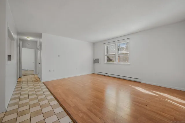 a view of an empty room and window