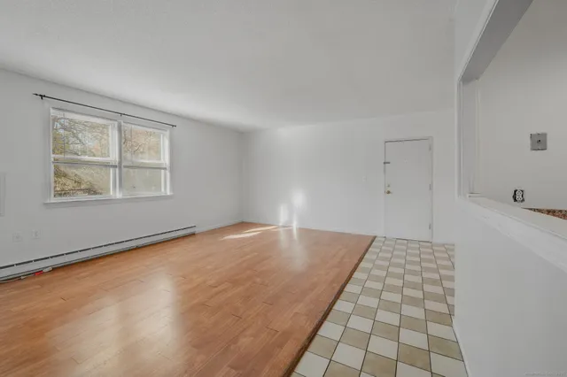 a view of an empty room and window