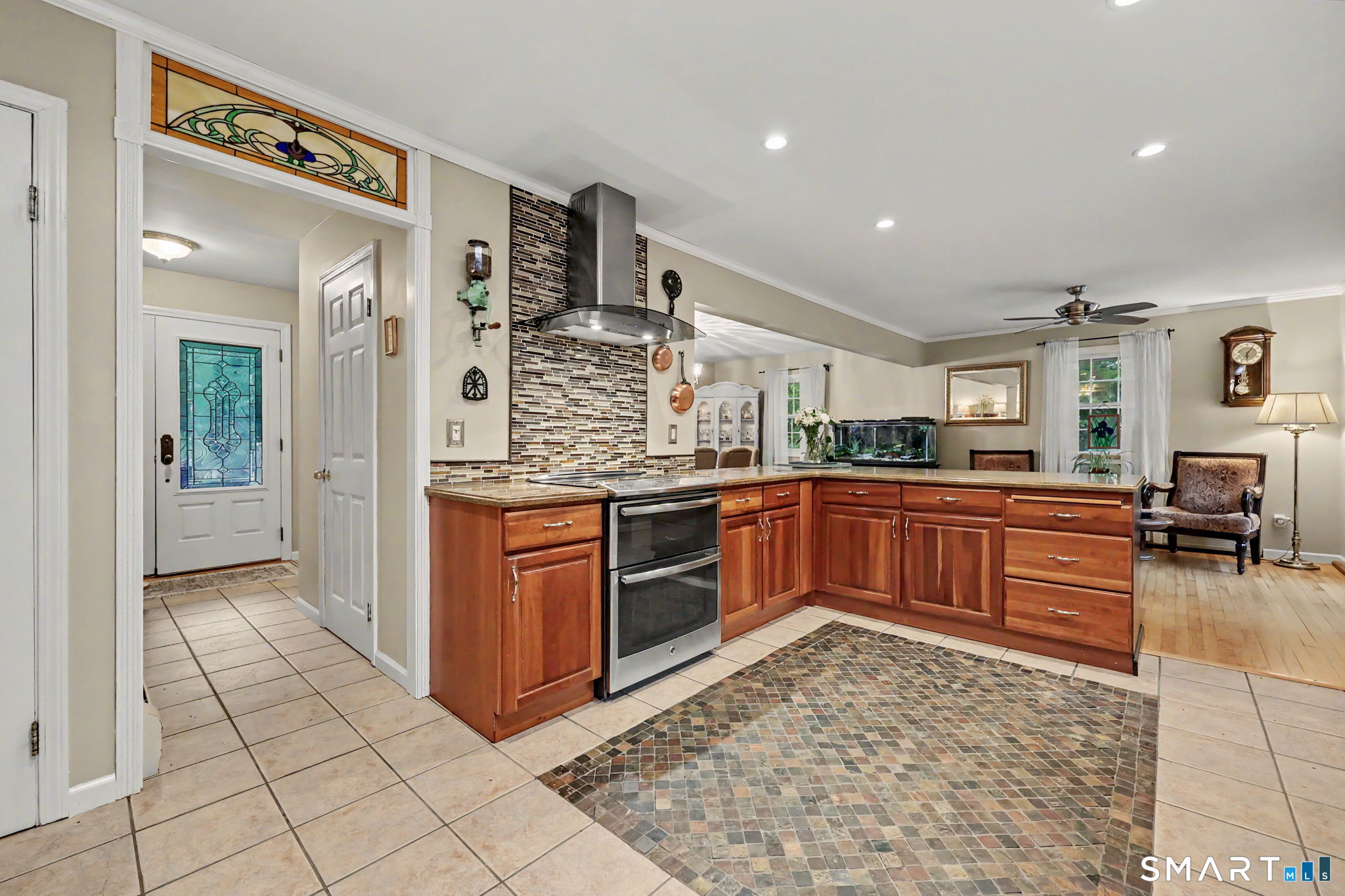 571 Wheeler Road Monroe, CT 06468 - Photo 10 of 40 a kitchen with stainless steel appliances granite countertop a stove and cabinets